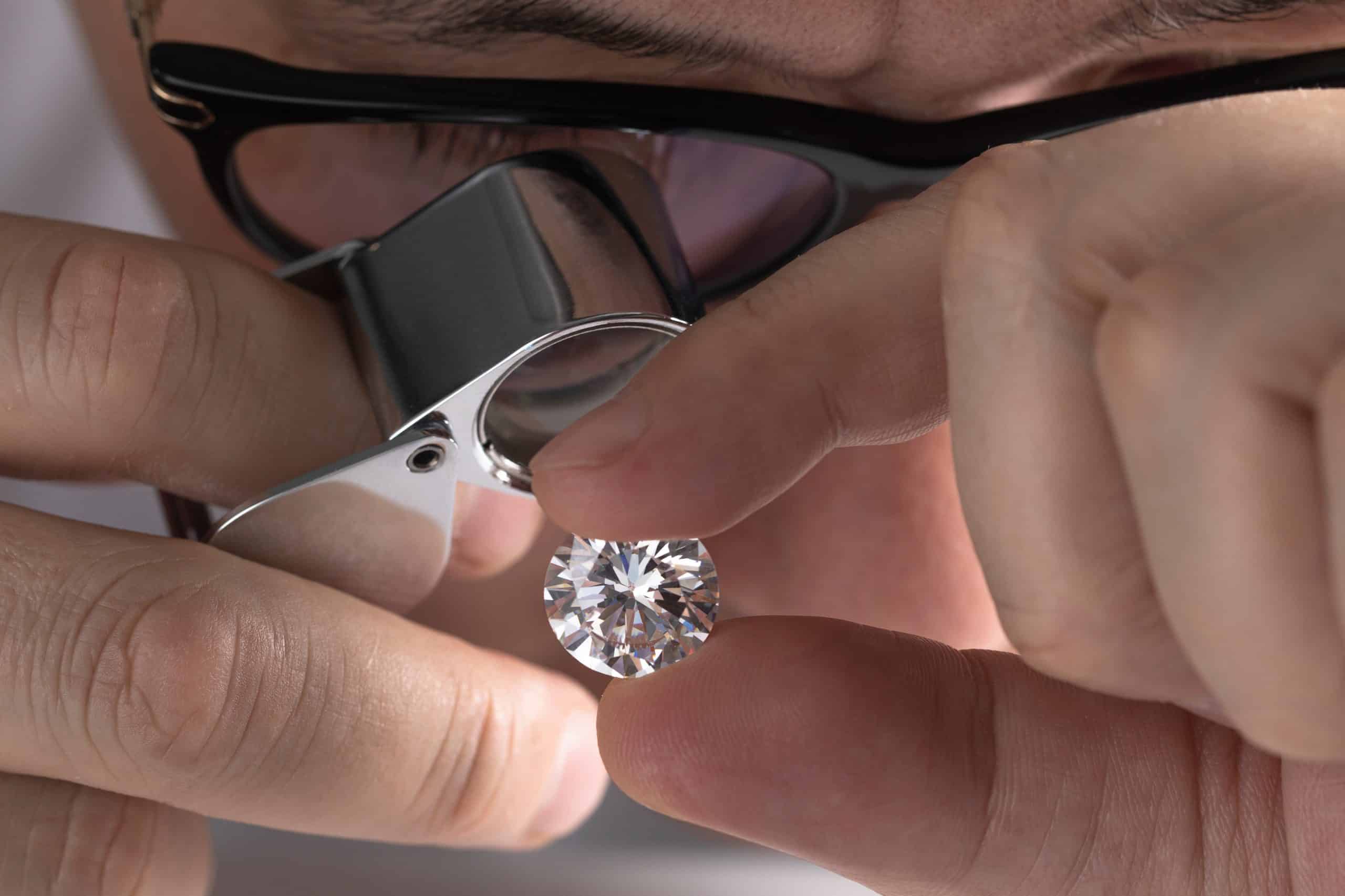 man viewing a diamond