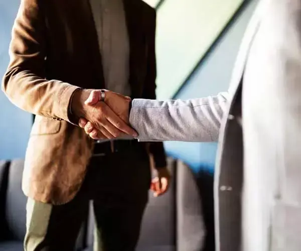 Buyer and Seller of Jewelry Shaking Hands on Offer